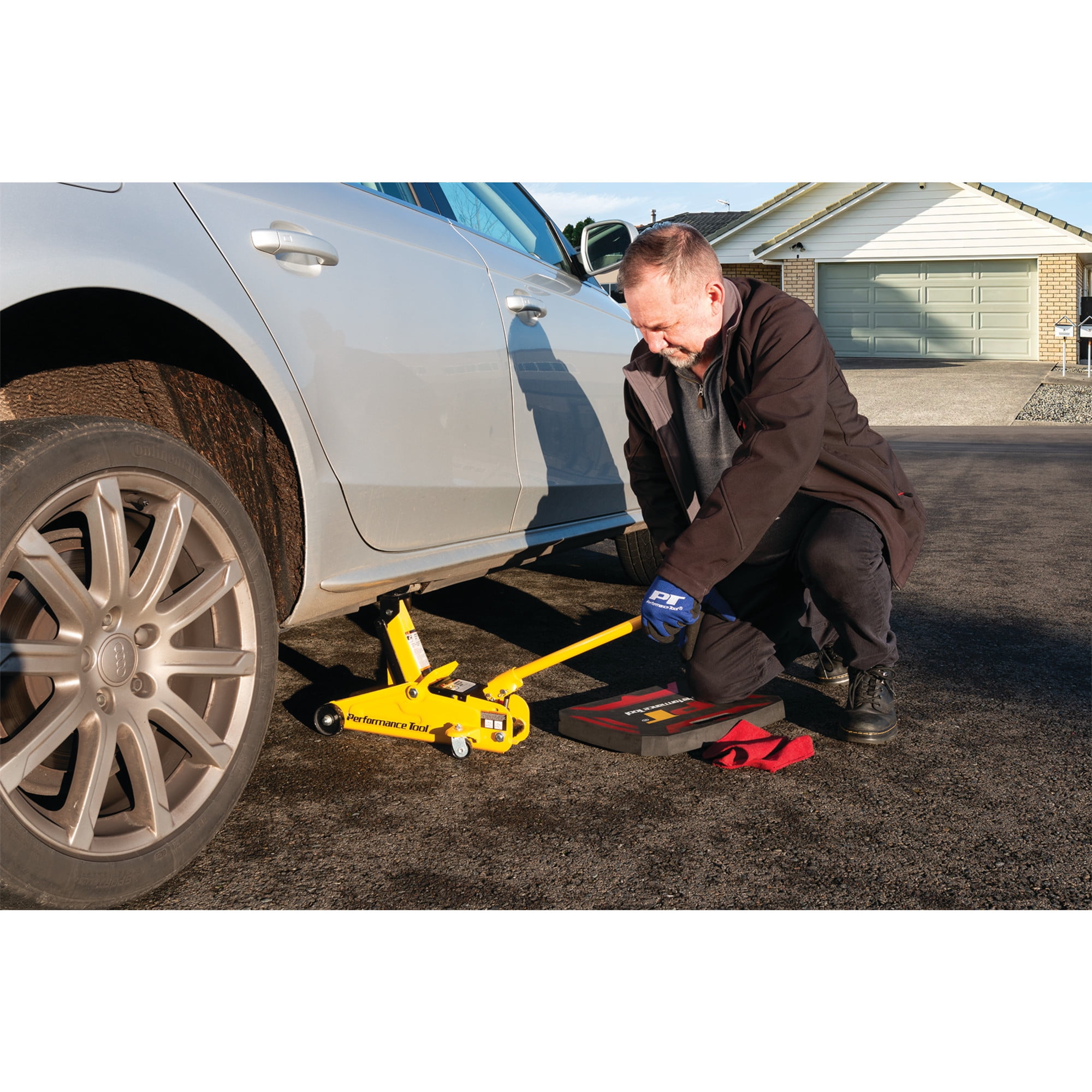 Performance Tool W1606 2-Ton Capacity Compact Trolley Jack - Carrying Handle, 4,000 Lbs. Capacity, Swivel Casters - Yellow - Image 8